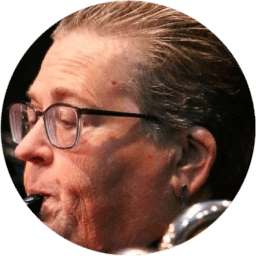 Close-up of a person playing a wind instrument.